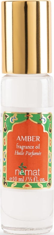 Nemat Amber roll-on frontal mostrando diseño elegante y portable