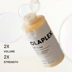 Olaplex No.4FINE pump dispensing shampoo into hand to show easy application