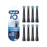 Oral-B iO black pack front packaging showing eight replacement brush heads and compatibility benefits
