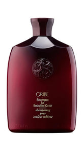 Oribe frontal botella mostrando etiqueta y beneficio de protección del color
