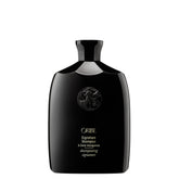 Oribe botella frontal mostrando el diseño de marca y beneficio profesional