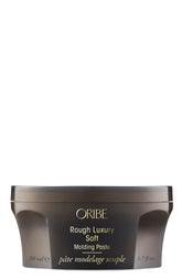 Oribe envase frontal mostrando la pasta y beneficio de diseño práctico