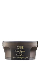 Oribe envase frontal mostrando la pasta y beneficio de diseño práctico