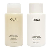 OUAI front packaging of shampoo and conditioner showing sleek bottles and easy use benefit