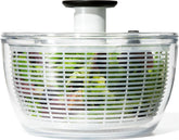 OXO Good Grips front view showing full salad spinner and bowl, tidy storage benefit