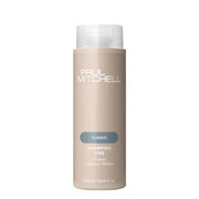 Paul Mitchell botella frontal mostrando el diseño y beneficio de limpieza suave