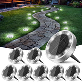 Peasur front view of eight solar ground lights showing uniform cool-white glow