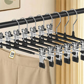 POZEAN front view of 30-pack hangers showing slim, space-saving profile and uniform black finish