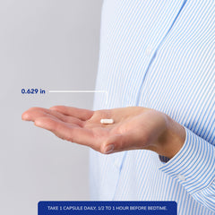 capsule next to a coin for scale demonstrating small size of Pure Encapsulations pill