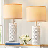 Reaketon front view pair white lamps showing elegant symmetry and ambient lighting