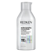 Redken bote frontal mostrando etiqueta y beneficio de reparación
