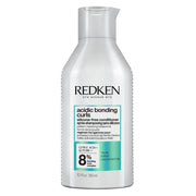 Redken frasco frontal del acondicionador mostrando marca y formato 300 ml