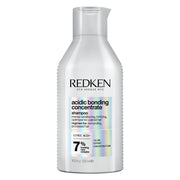 Redken front bottle view showing sleek packaging and professional strength benefits