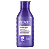 Redken Blondage frontal del envase mostrando tono profesional y beneficio de corrección