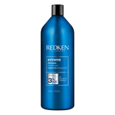 Redken Extreme frontal del envase mostrando etiqueta y tamaño grande, beneficio profesional