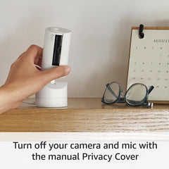 Ring Pan-Tilt Indoor Cam mounted on a shelf showing panoramic coverage and discreet monitoring benefit