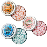 Sour Drops frente de las tres latas mostrando variedades y conveniencia