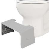 Squatty Potty front view showing compact gray travel stool and stable base benefit