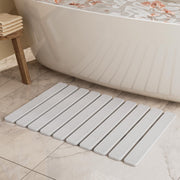 Summer&Kiss front view of folded stone bath mat showing clean edges and quick-dry benefit
