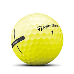 TaylorMade ball held in hand showing size and high-visibility yellow for easier spotting
