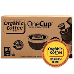 The Organic Coffee Co. pods in hand for scale and easy single-serve benefit