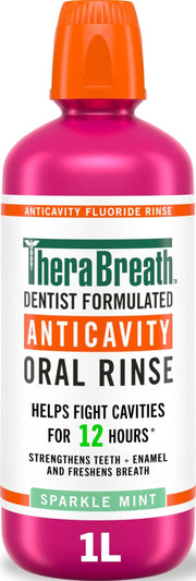 TheraBreath botella frontal 1 litro mostrando etiqueta y tamaño para uso familiar