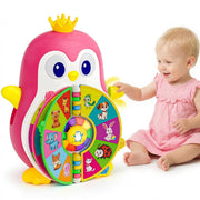 ToddlerCley pingüino frontal mostrando luces y botones, estimula atención