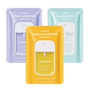 Touchland front packaging showing three-scent travel set and convenient carry