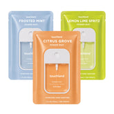 Touchland front packaging trio showing all three scents and benefits