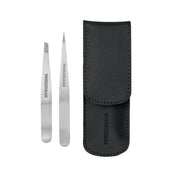 Tweezerman juego frontal mostrando pinzas y estuche para precisión y protección