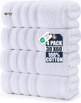 Utopia Towels front view showing four white XL towels and neat presentation benefit