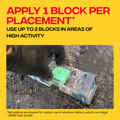 Victor bait block placed in refillable station demonstrating secure, safer placement