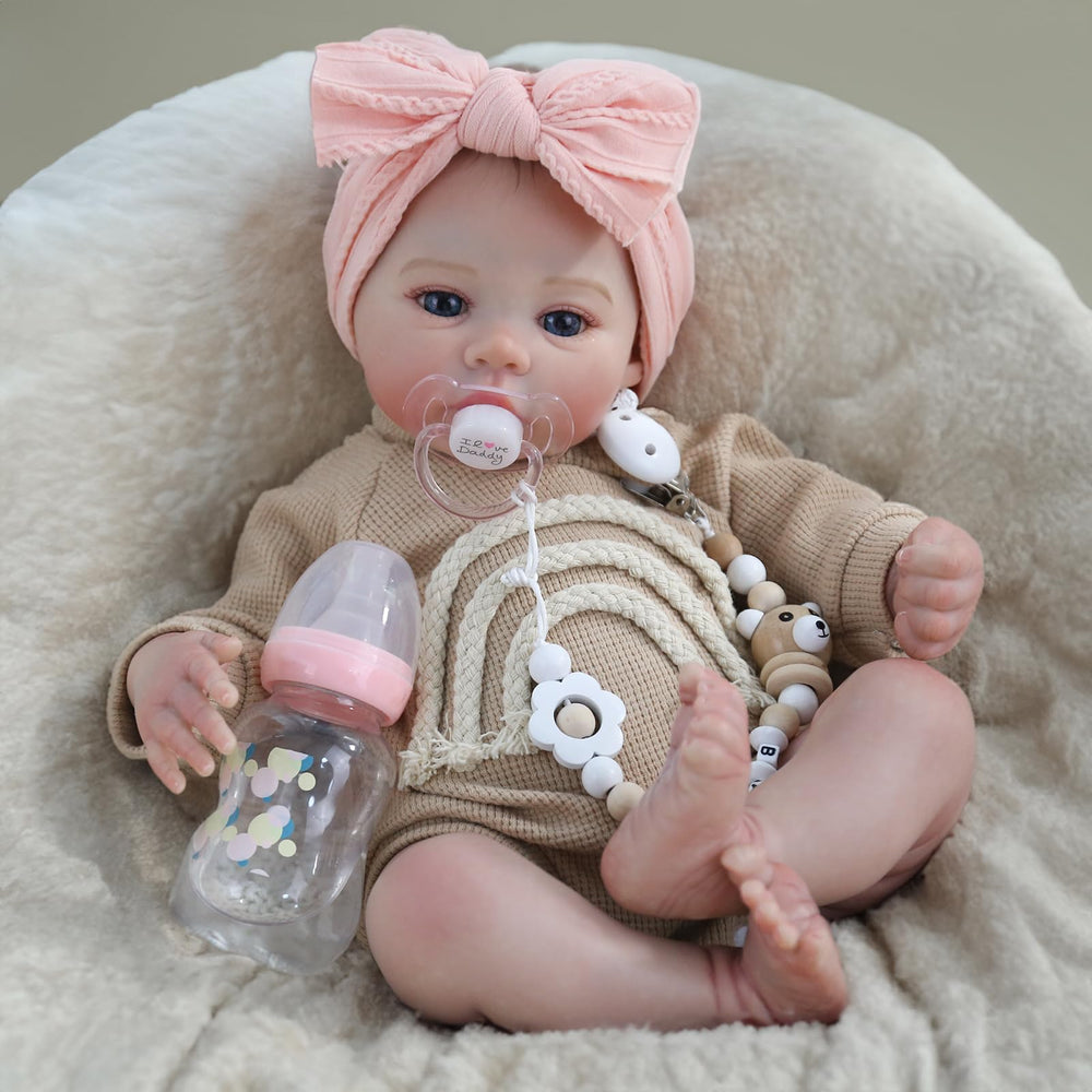 WOOROY front view of 18-inch reborn baby showing lifelike pose and outfit benefit realism