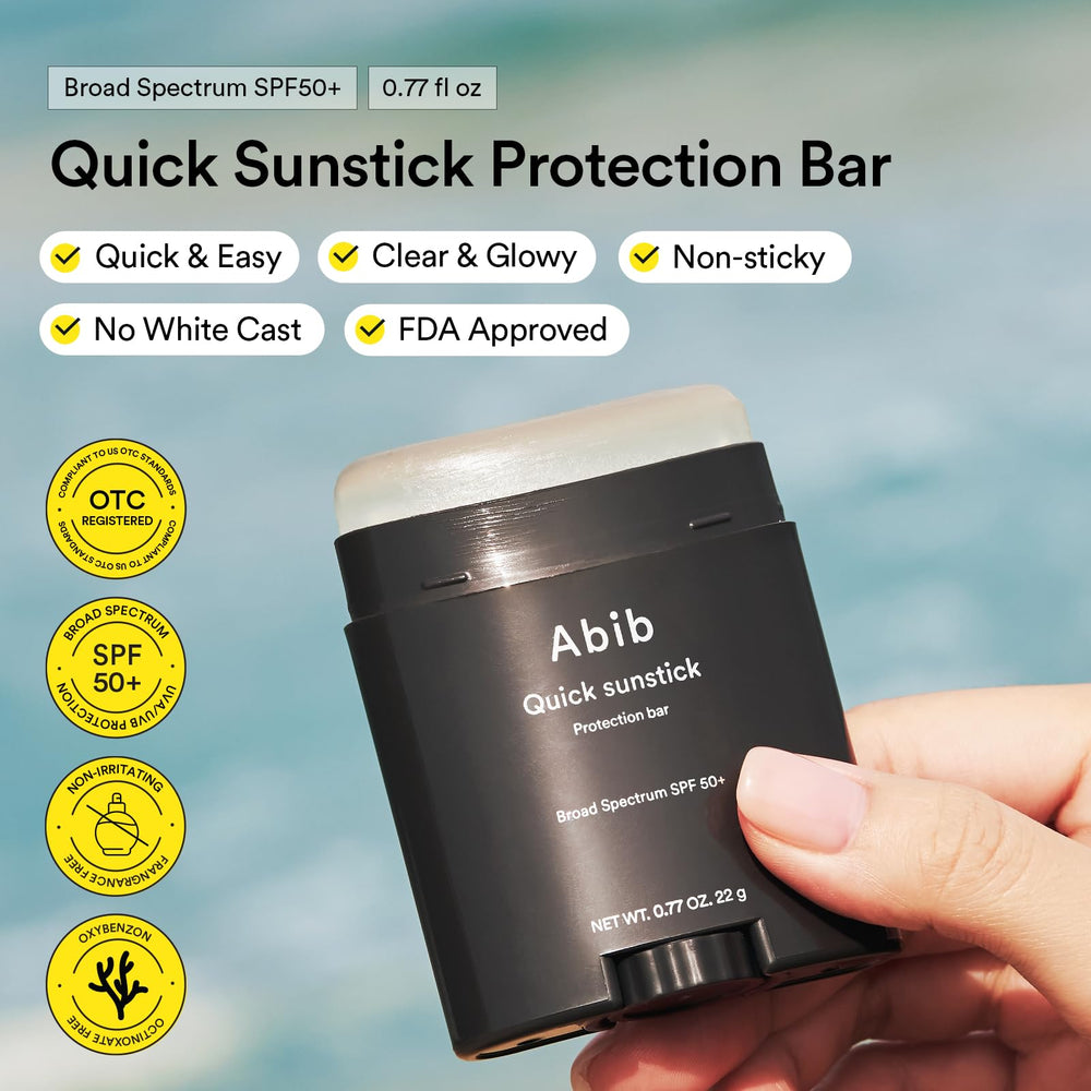 Abib sunsticks held in hand to show compact scale and portability benefit