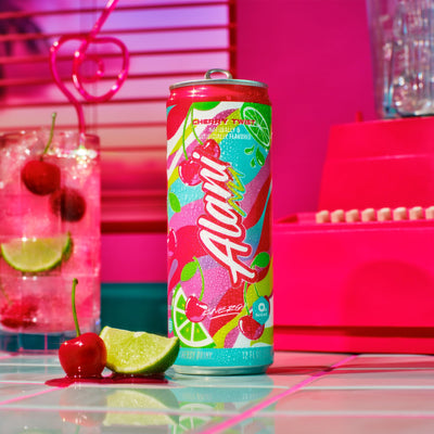 Alani Nu pouring Cherry Twist into glass to show color and refreshing serving suggestion