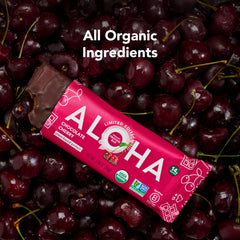 ALOHA bar beside a measuring scale showing serving size and 14g protein per bar benefit