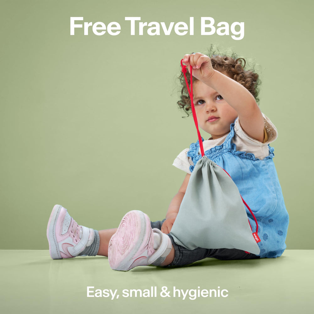 Toddler in stroller with Alpine Muffy Baby showing travel convenience and reduced noise benefit