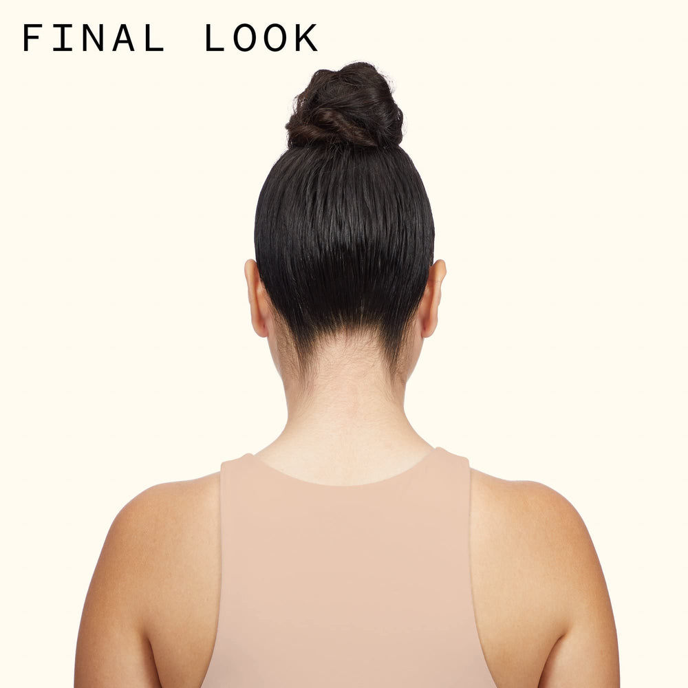 amika Fluxus held in hand to show size and portability for on-the-go styling