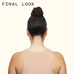 amika Fluxus held in hand to show size and portability for on-the-go styling