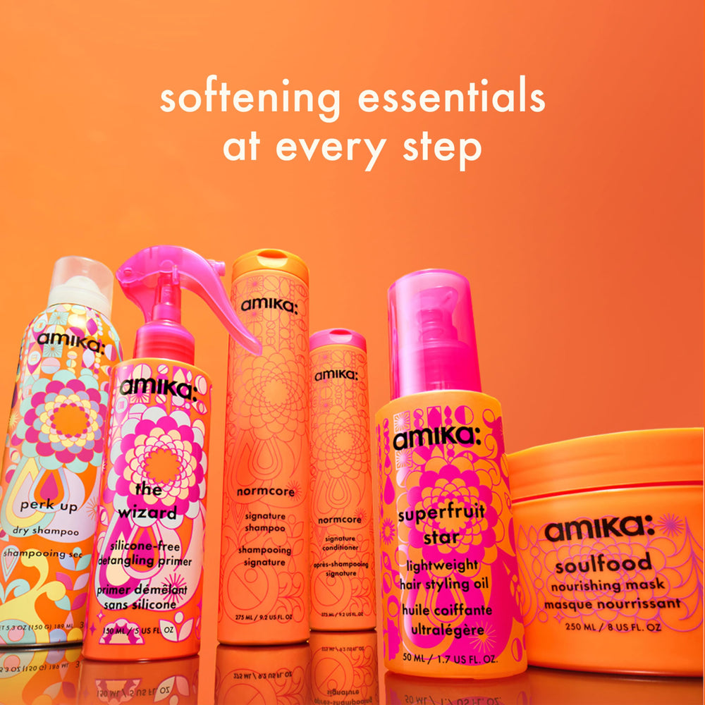 amika being applied to damp hair for detangling and easier styling