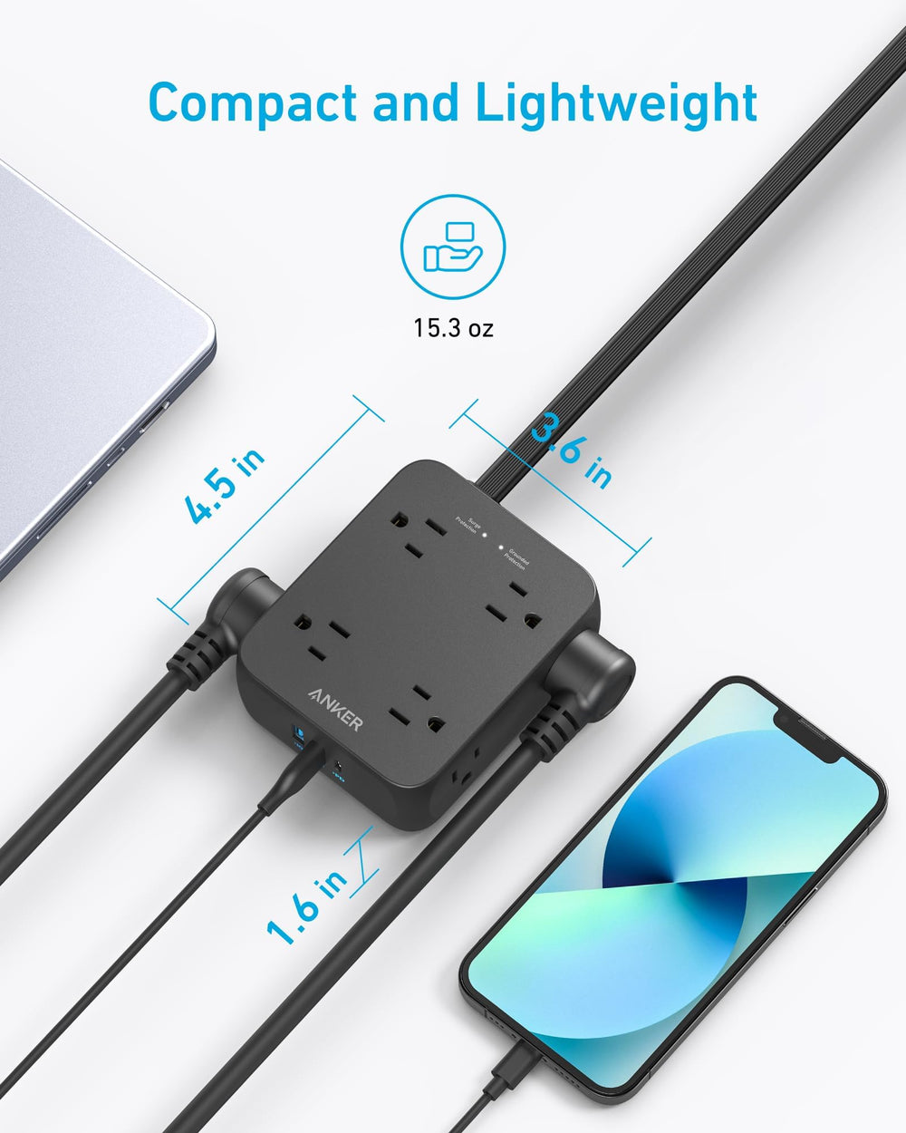 Anker regleta en escritorio con laptop y lámpara, alimentación ordenada