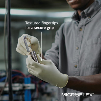 Ansell MICROFLEX glove next to ruler showing 245mm length for fit