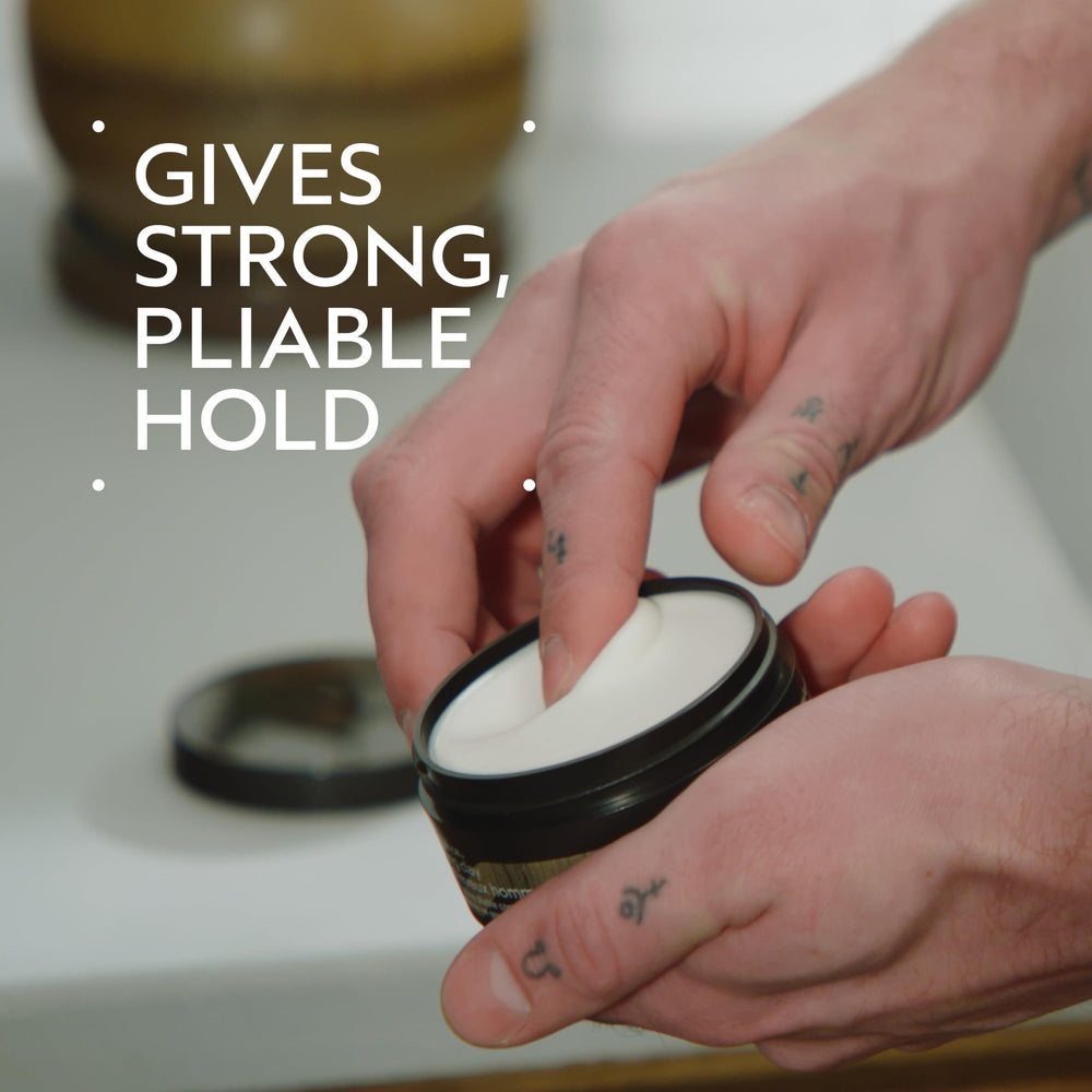 Aveda grooming clay texture closeup showcasing matte paste for easy texturizing benefit: styling control