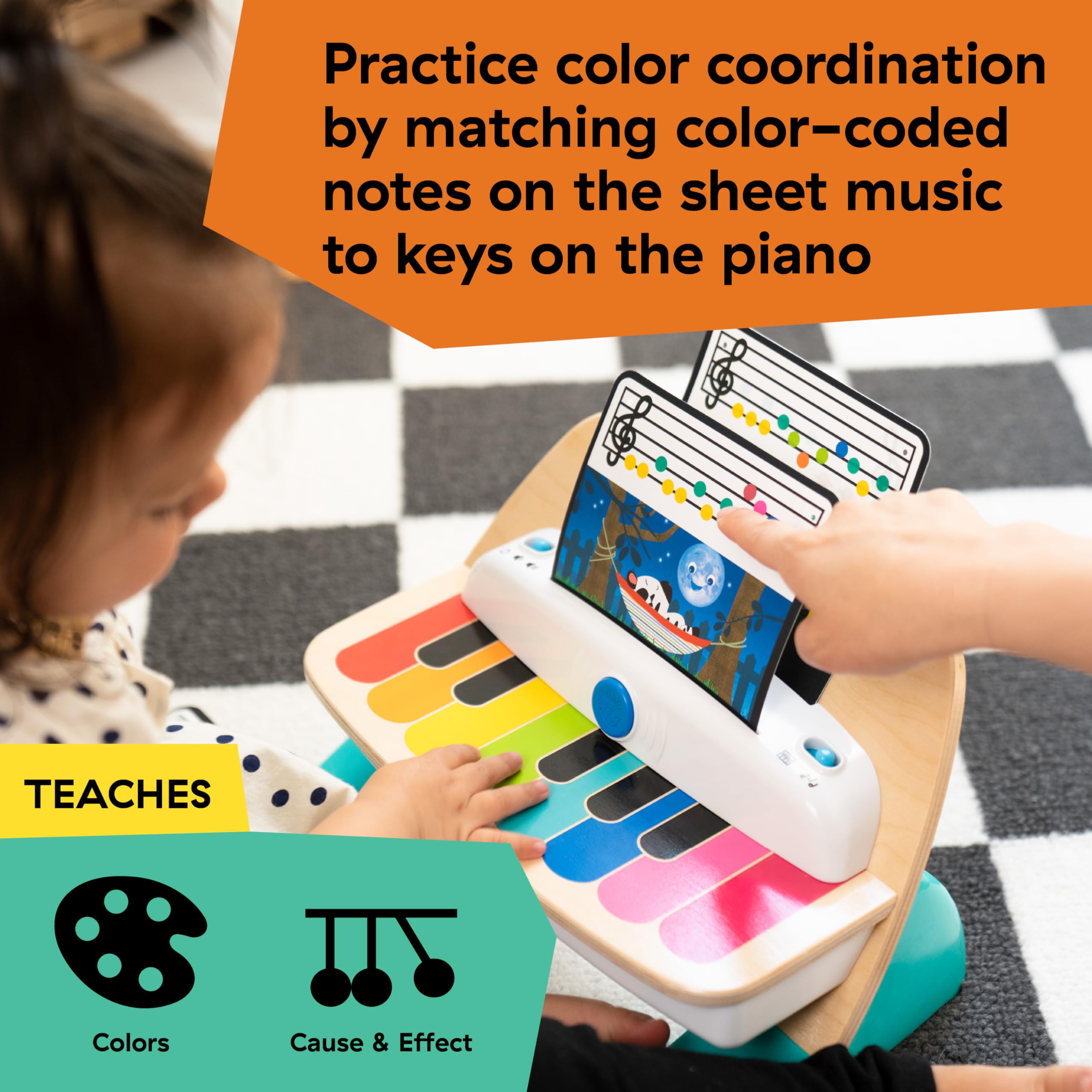 Baby Einstein piano with three color-coded music sheets for learning notes and coordination