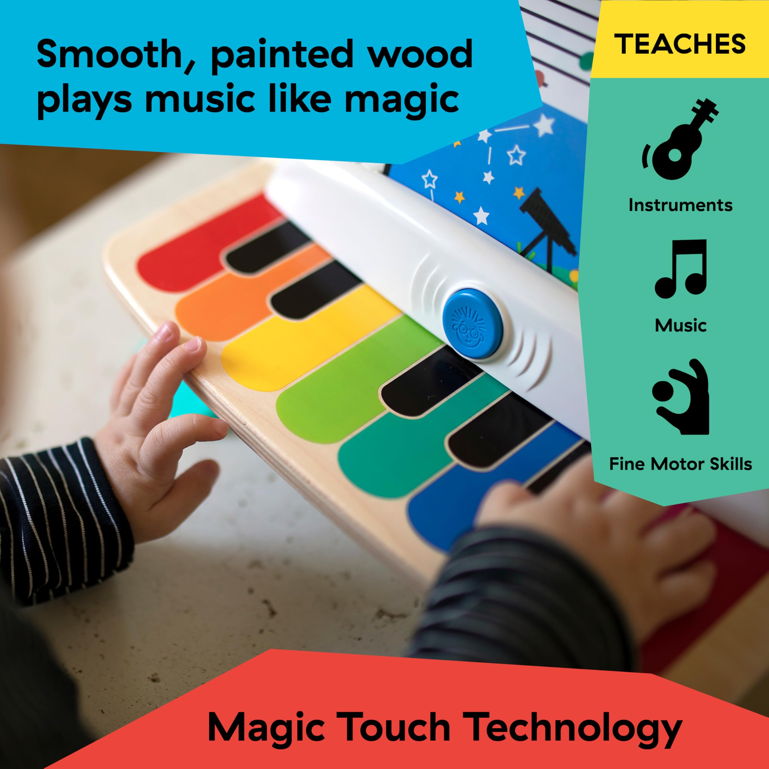 Baby Einstein piano beside an adult hand showing compact toddler-friendly size