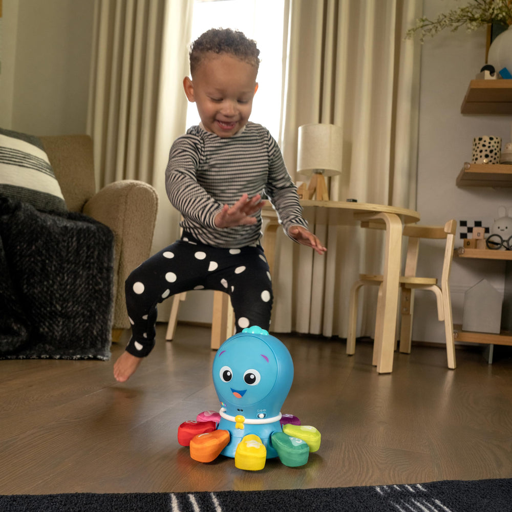 Plano de etiqueta y controles de Opus Go Baby Einstein, muestra volumen y modos