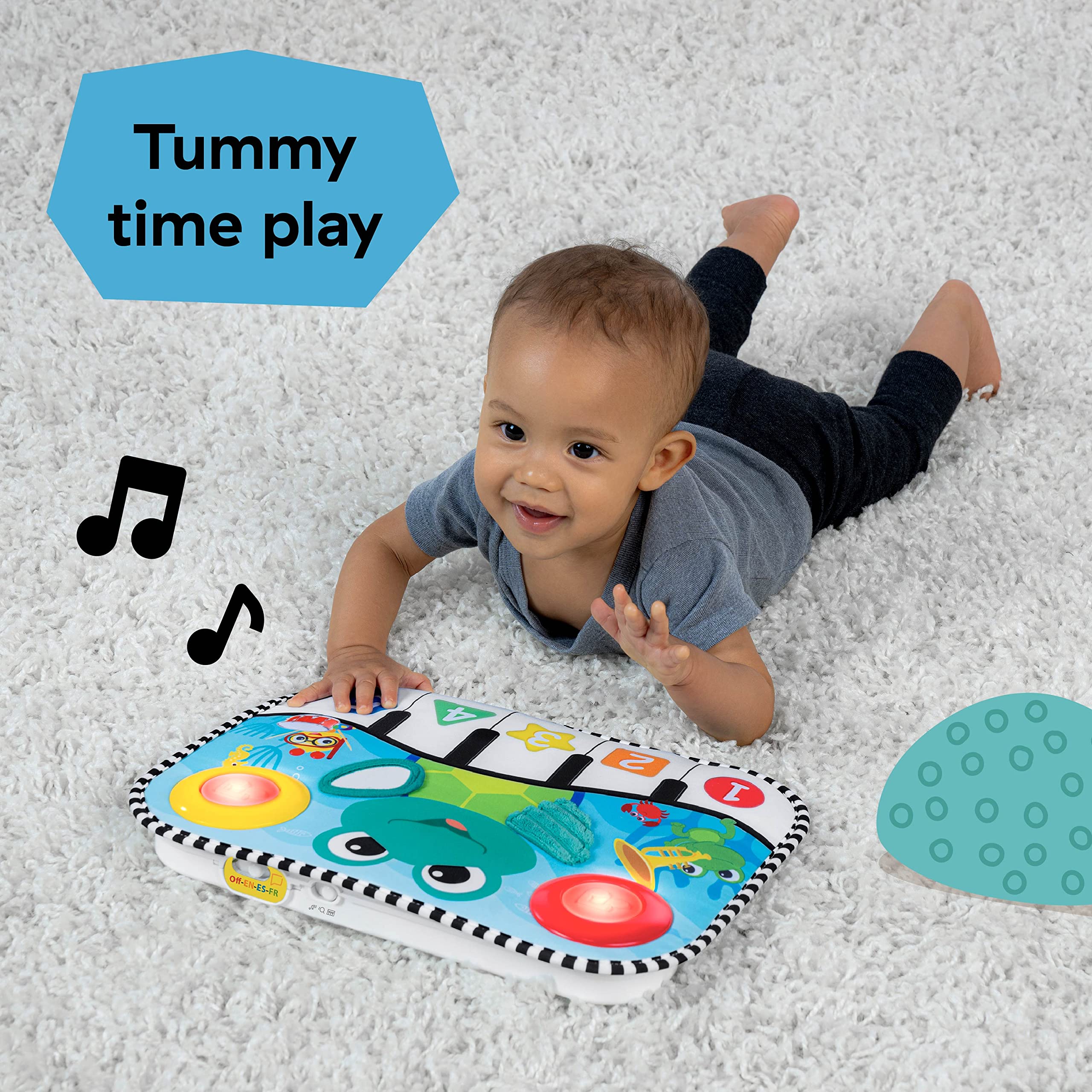 Baby Einstein pad attached to crib rails for secure reclined play