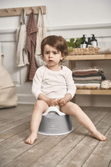 BabyBjörn potty placed in family bathroom demonstrating travel-ready convenience