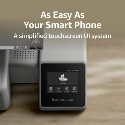 Bambu Lab A1 Mini beside hands to show compact scale and desktop convenience