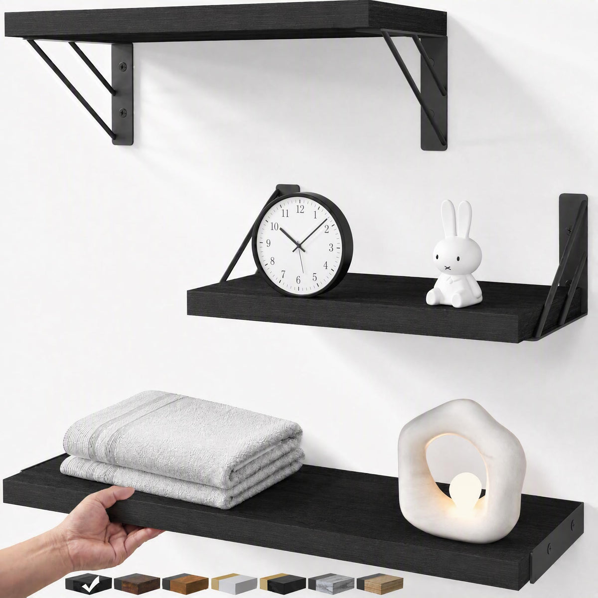 BAYKA front view of three black floating shelves showing modern styling and space saving